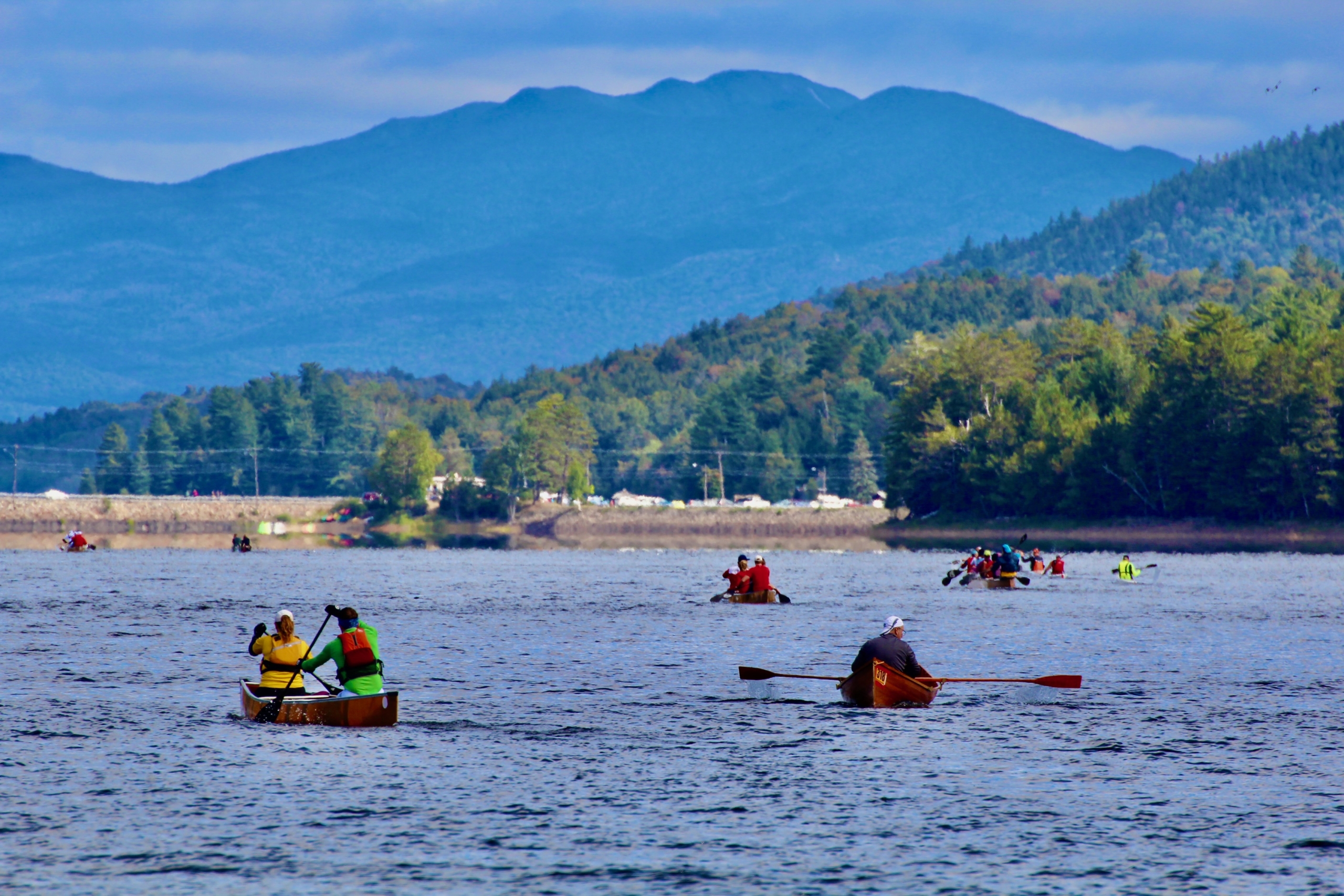 Paddling on Long Lake with several canoes and kayaks